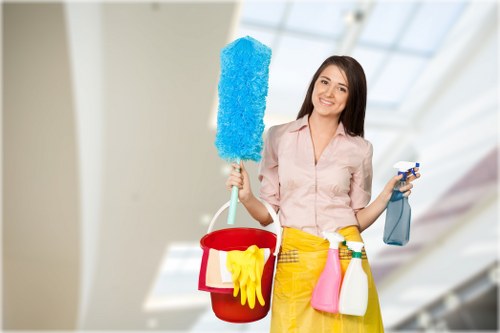 Professional cleaner completing a kitchen clean in W2