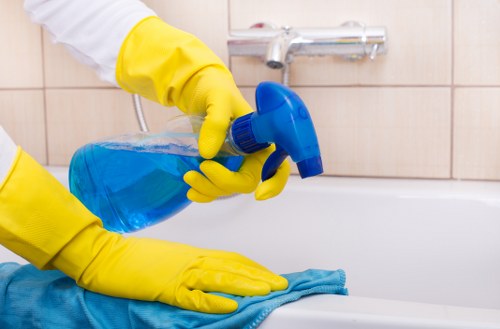 Professional cleaners maintaining a workspace in W2